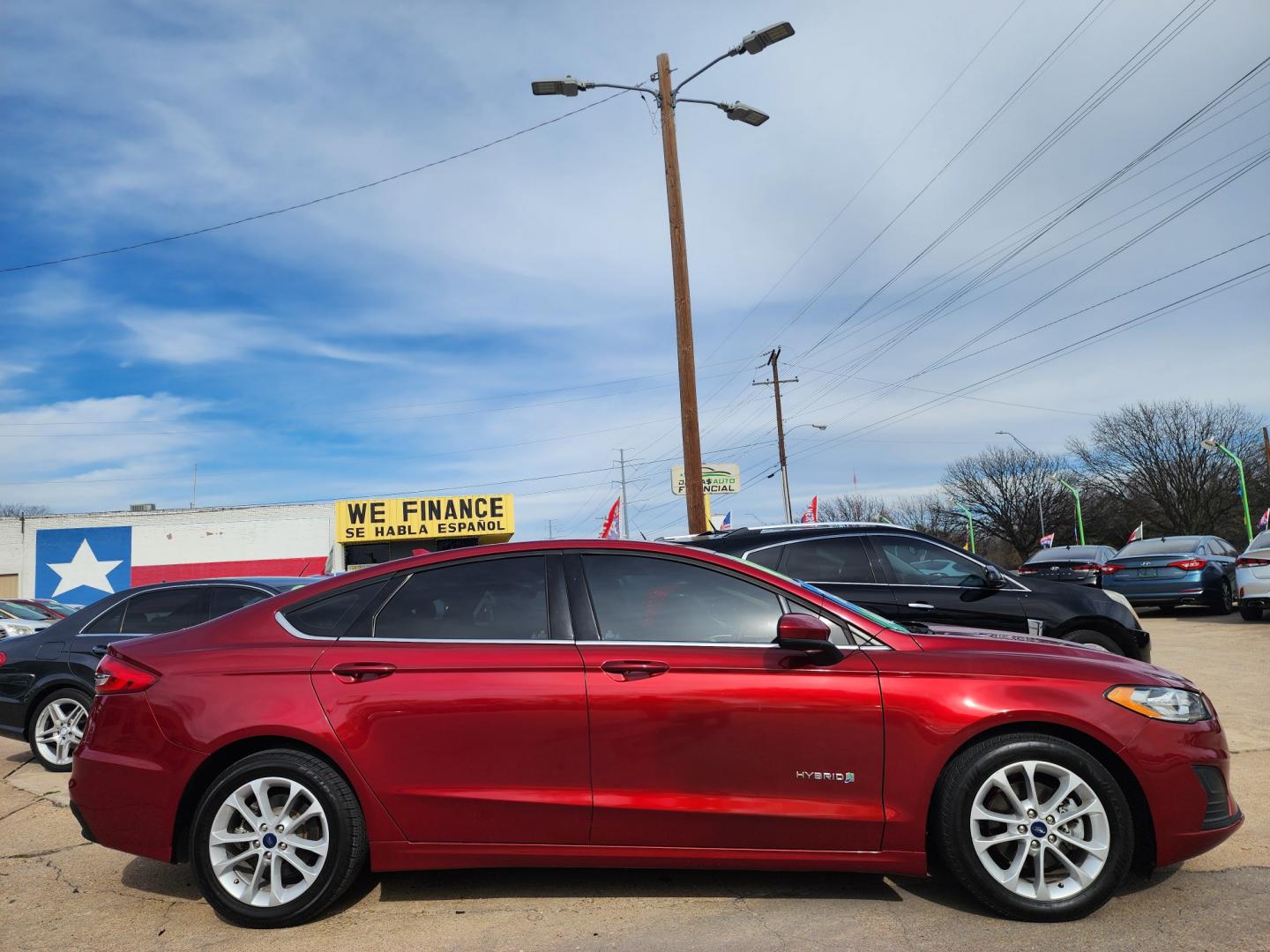 2019 RED Ford Fusion Hybrid SE (3FA6P0LU7KR) , AUTO transmission, located at 2660 S.Garland Avenue, Garland, TX, 75041, (469) 298-3118, 32.885551, -96.655602 - Welcome to DallasAutos4Less, one of the Premier BUY HERE PAY HERE Dealers in the North Dallas Area. We specialize in financing to people with NO CREDIT or BAD CREDIT. We need proof of income, proof of residence, and a ID. Come buy your new car from us today!! This is a 2019 FORD FUSION SE HYBRID - Photo#2